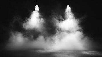 An atmospheric stage is set with lighting and a smoky haze, creating a dramatic and theatrical scene in a monochrome image. photo