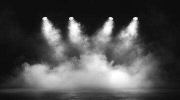 Stage lights illuminate a smoky atmosphere. A spotlight shines through the fog on a dark stage for an atmospheric performance setting. photo