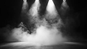 Monochrome image showcasing a stage shrouded in a mysterious fog under illuminated spotlights, creating an atmospheric effect. photo