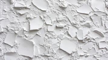 Detailed view of a pure white textured surface with rough patches and flakes, creating an abstract and visually engaging pattern. photo