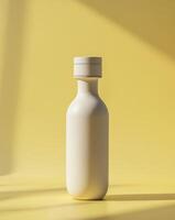 Stylish bottle layout with a lid and laconic design on a bright yellow background photo
