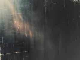 Light leak with a textured black background and grunge effect for overlay designs and vintage effects photo