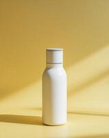 Stylish bottle layout with a lid and laconic design on a bright yellow background. photo