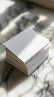 Stack of White Business Cards on Marble Surface photo
