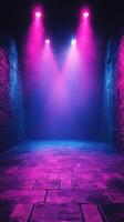 Colorful lights illuminate an empty stage with mist in a dark setting during an evening performance photo