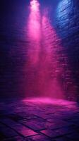 Vibrant purple and pink light beams illuminate a stone-walled space during an evening event photo