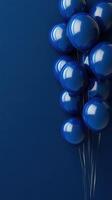 Blue balloons clustered against a dark blue background create a striking visual effect for celebrations or events photo