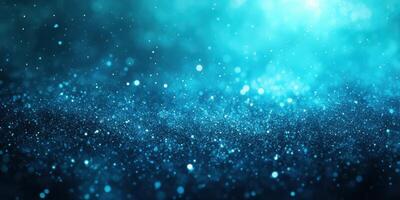 Vibrant blue particles glimmering in a captivating display of light and color against a dark background photo