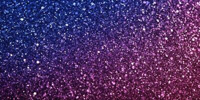 Colorful glitter particles create a mesmerizing background in shades of purple and pink photo
