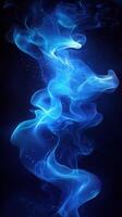 Vibrant blue wisps of smoke swirl against a dark background, creating an ethereal atmosphere in a digital space photo