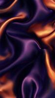 Richly textured purple and orange silk fabric draped softly to create elegant waves and luxurious patterns photo