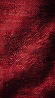 Textured red fabric showcasing subtle patterns in natural light during the afternoon photo