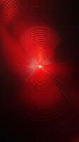 Vibrant red abstract artwork featuring concentric patterns radiating from a central point photo
