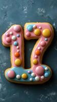 Colorful number cookie decorated with sprinkles for a birthday celebration photo