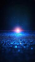 Bright light emanates from a glittering blue surface in a dark environment showcasing a mesmerizing visual effect photo