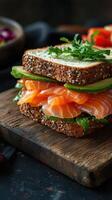 Delicious open-faced sandwich with fresh salmon and vegetables on a wooden surface ready to be enjoyed photo