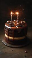Chocolate cake adorned with candles and decorations celebrates a special occasion in soft lighting photo