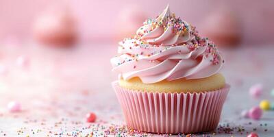 Delicious pink frosted cupcake with sprinkles on a festive table setting during a spring celebration photo