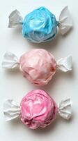 Colorful cotton candy treats arranged in a playful display on a white surface for a fun dessert experience photo