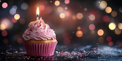 Delightful cupcake with pink frosting and a lit candle on a festive background photo