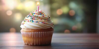 Cupcake with colorful frosting and candle presented on a wooden table in a bright indoor setting photo