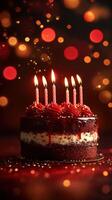 Celebrate a special occasion with a beautifully decorated cake featuring glowing candles and festive lights photo