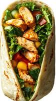 Delicious chicken wrap filled with fresh vegetables and herbs for a healthy meal choice photo