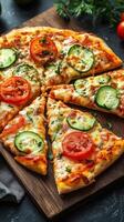 Delicious freshly baked vegetable pizza with slices of tomato and cucumber served on a wooden board photo