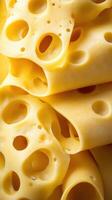Slices of yellow cheese showcasing unique textures and holes during a close-up view photo