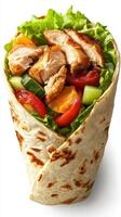 Grilled chicken wrap filled with fresh vegetables and greens served in a warm tortilla for a healthy meal photo