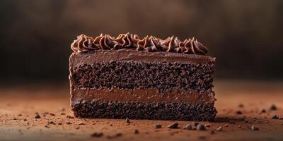 Decadent chocolate cake slice displayed on a wooden table with rich frosting and chocolate crumbs photo