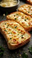 Freshly baked cheesy bread topped with herbs served at a rustic kitchen table photo