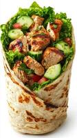 Delicious grilled chicken wrap filled with fresh vegetables served in a soft tortilla photo
