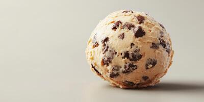 Delicious chocolate chip ice cream scoop on a plain background ready to be enjoyed photo