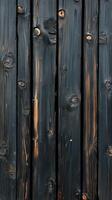 Textured wooden planks with a charcoal finish create a striking surface pattern and aged appearance in a contemporary setting photo
