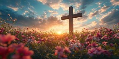 Beautiful sunset over a field of flowers with a wooden cross symbolizing peace and hope photo