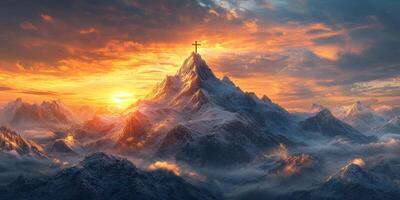 Majestic mountain landscape with a cross at sunset illuminating the sky and surrounding peaks photo