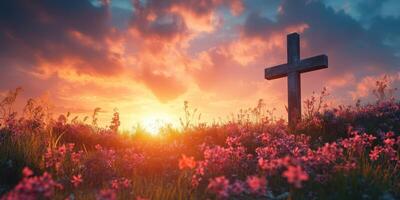 Beautiful sunset over a field of flowers with a cross, symbolizing hope and serenity in nature photo