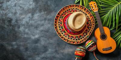 Vibrant musical instruments and traditional hat display on textured surface with tropical leaves in warm natural light photo
