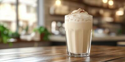 Refreshing iced beverage served in a glass with whipped cream and chocolate shavings in a cozy cafe setting photo