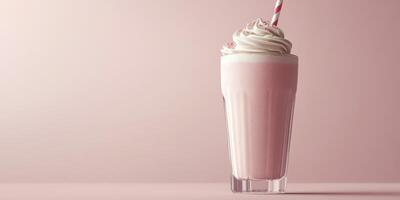 Delicious milkshake topped with whipped cream served in a tall glass with a straw photo