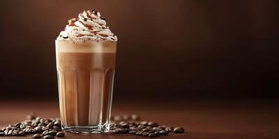 Creamy mocha topped with whipped cream and chocolate shavings served in a glass with coffee beans photo