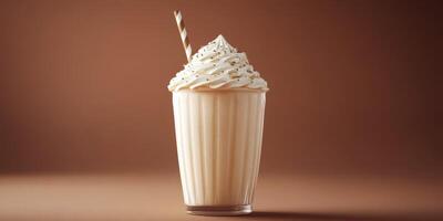 Creamy dessert drink topped with whipped cream and chocolate shavings in a stylish cup photo