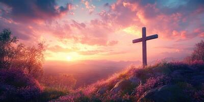 Serene sunset over a hill with a wooden cross surrounded by blooming flowers in a tranquil landscape setting photo