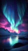 Stunning northern lights illuminate serene lake and snowy mountains at twilight photo