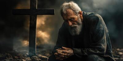 Elderly man in deep contemplation near a cross in a somber, atmospheric setting with dark clouds and smoke photo