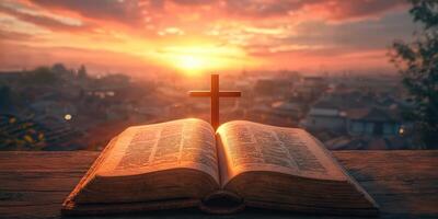 Sunset view of an open Bible with a cross, symbolizing faith and reflection in a tranquil landscape photo