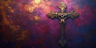 Intricate golden crucifix against a textured, colorful background emphasizing religious significance photo