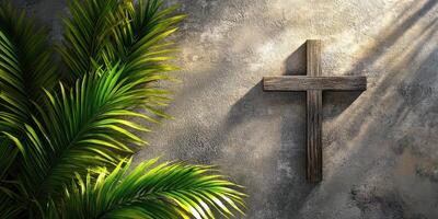 Wooden cross on textured wall with vibrant green palm leaves in natural light photo