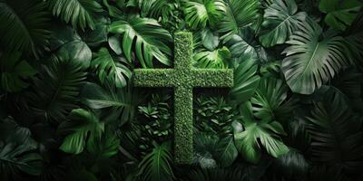 Green foliage background featuring a cross made of lush plants suitable for nature-themed religious contexts photo